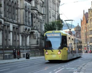 Tram travelling in Manchester. Manchester is the location of HairCon 2024