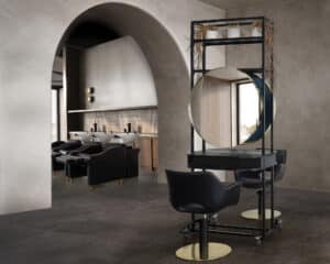 Comfortel Salon featuring two chairs and a mirror and three wash stations. Comfortel is one of the collaborators at HairCon.