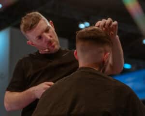 Alan Beak doing a demostration in partnership with Wahl. Wahl and their team will be live at HairCon.