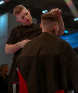 Alan Beak doing a demostration in partnership with Wahl. Wahl and their team will be live at HairCon.