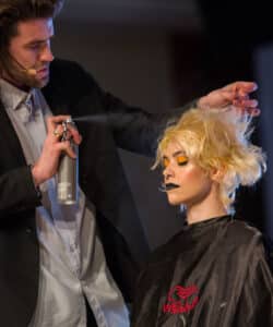 Guy Kleinhaus with hair model. Guy Kleinhaus will be appearing on the main stage at HairCon.