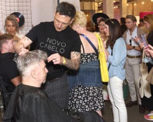 Rob Wood doing a demonstration on the Novo Cabelo Stand at HairCon, Manchester 2024.